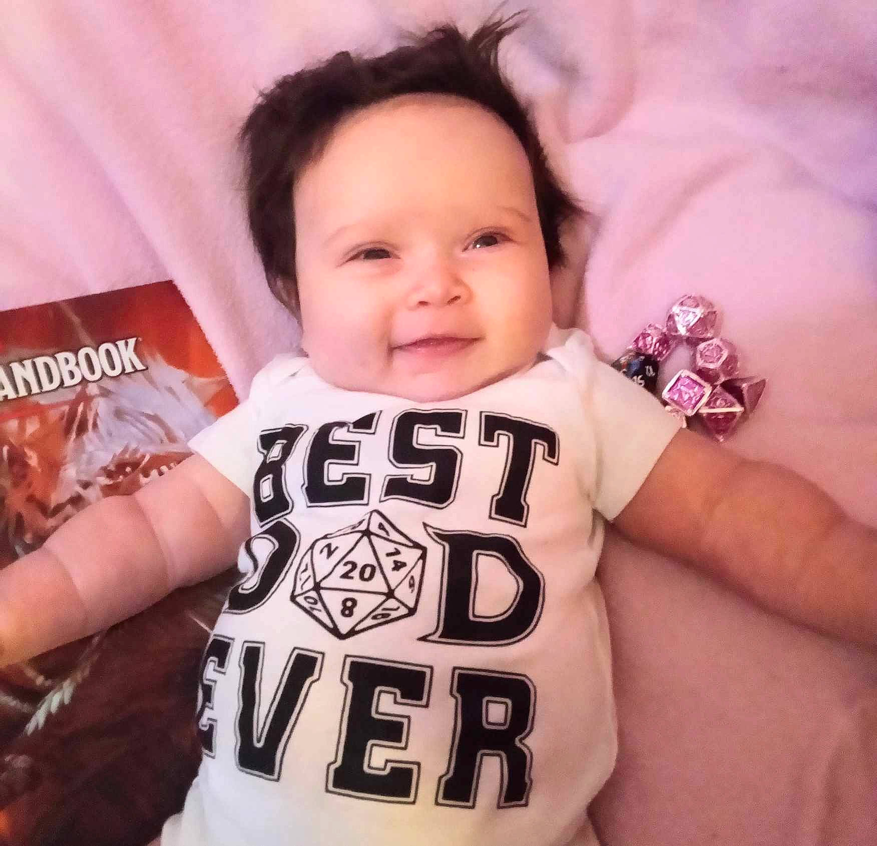 Anastasia is registered to the contest to win money with this photo: arm, baby, baby_toddler_clothing, cool, eyelash, facial_expression, finger, gesture, hairstyle, hand, happy, head, joy, neck, person, pink, skin, sleeve, smile, textile