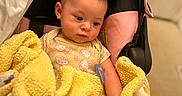 Makayla joined the competition — help win amazing prizes! baby, baby_hand, baby_head, blanket, car_seat, cozy, cute, expression, fabric, hair, indoor, infant, onesie, pacifier, pink, portrait, seat_canopy, sleepy, soft_texture, yellow_blanket