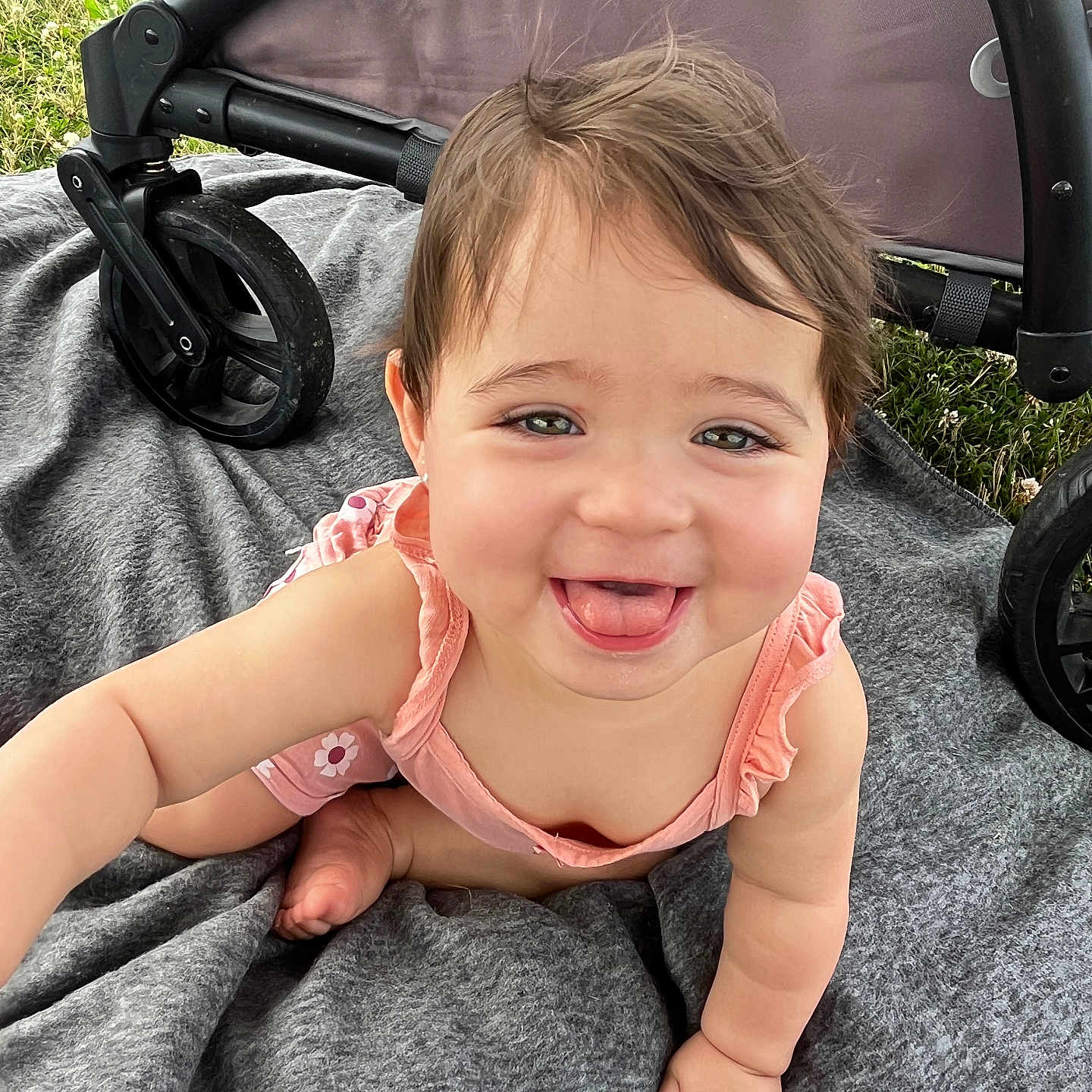 Blakely is registered to the contest to win money with this photo: accessories, baby, babylaughing, bodypart, clothing, crawling, dress, face, happy, head, laughing, machine, mouth, person, photography, portrait, smile, stroller, teeth, wheel