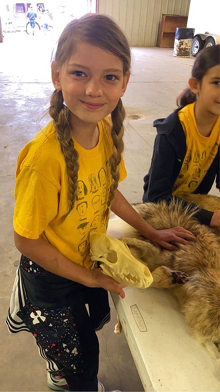 Nevaeh is registered to the contest to win money with this photo: child, companion_dog, event, fun, fur, hair, happy, joy, livestock, pattern, person, photography, sleeve, smile, t_shirt, terrier, yellow