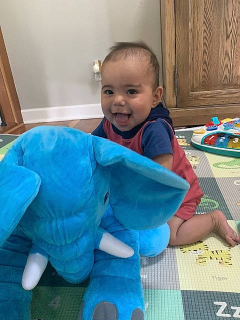 Adrian joined the competition — help win amazing prizes! azure, baby, baby_toddler_clothing, blue, child, comfort, electric_blue, floor, flooring, fun, happy, head, person, play, room, sitting, sleeve, smile, standing, toddler