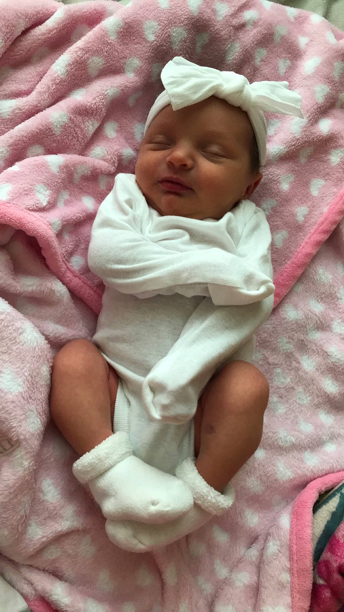 Iyanna is registered to the contest to win money with this photo: baby, child, headwear, linens, person, pink, toddler