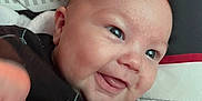 Bailey joined the competition — help win amazing prizes! baby, bodypart, clothing, couch, cushion, face, finger, furniture, happy, head, homedecor, laughing, mouth, newborn, person, photography, portrait, smile, t_shirt, teeth