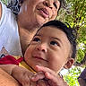 Samuel is registered to the contest to win money with this photo: baby, adult, person, child, face, smile, skin, hair, hand, outdoor, nature, tree, leaf, sunlight, portrait, closeup, expression, love, happy, family