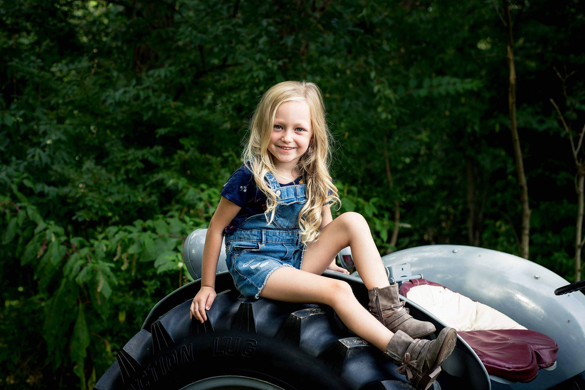 Legend joined the competition — help win amazing prizes! all_terrain_vehicle, auto_part, automotive_tire, automotive_wheel_system, blond, boot, brown_hair, child_model, fender, joy, overall, person, photo_shoot, portrait_photography, synthetic_rubber, tire_care, tread