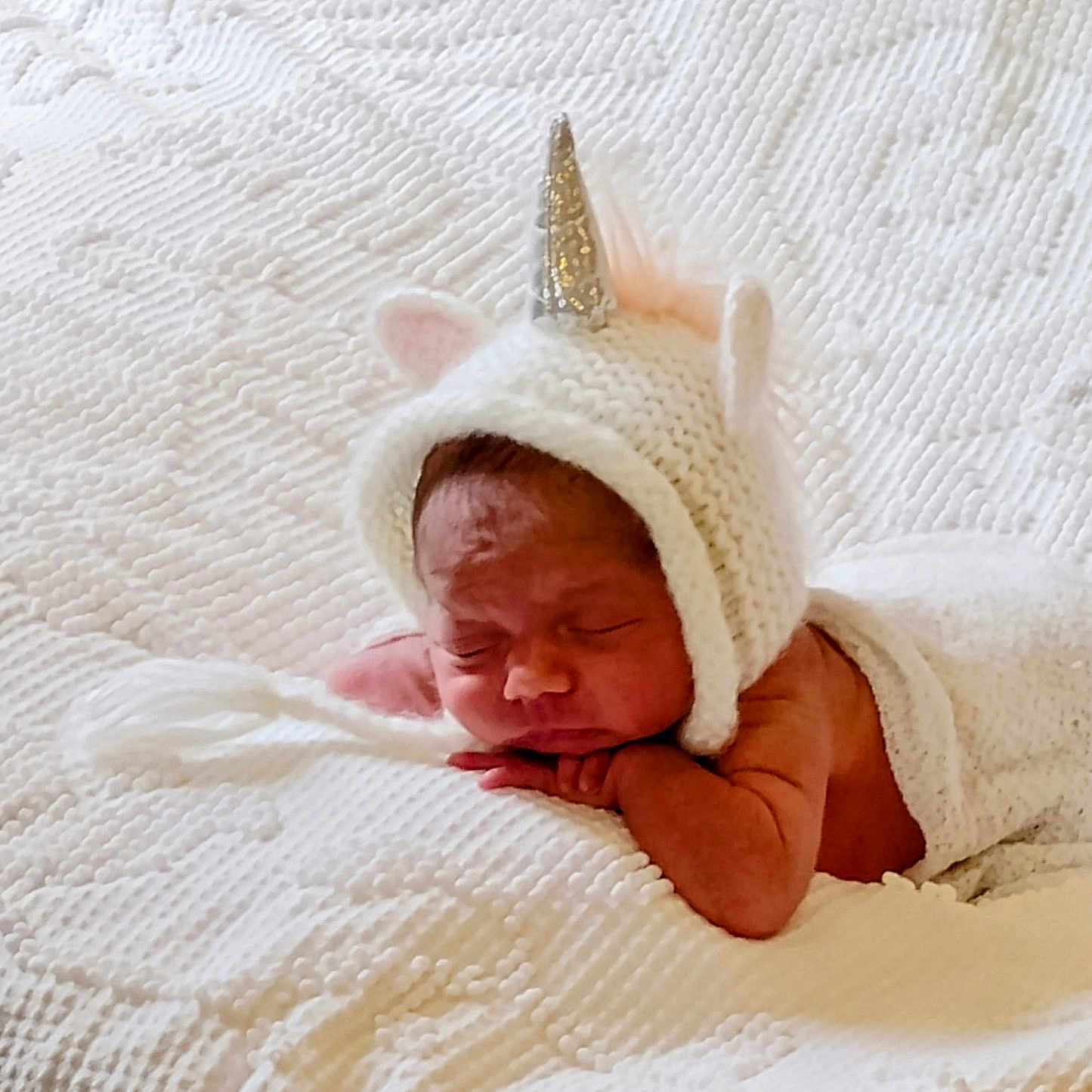 Lavaella joined the competition — help win amazing prizes! newborn, baby, sleeping, blanket, knitted_hat, unicorn, horn, pink_ears, white_bedspread, soft_texture, cozy, resting, infant, cute, portrait, indoors, peaceful, sleep, wrapped, child