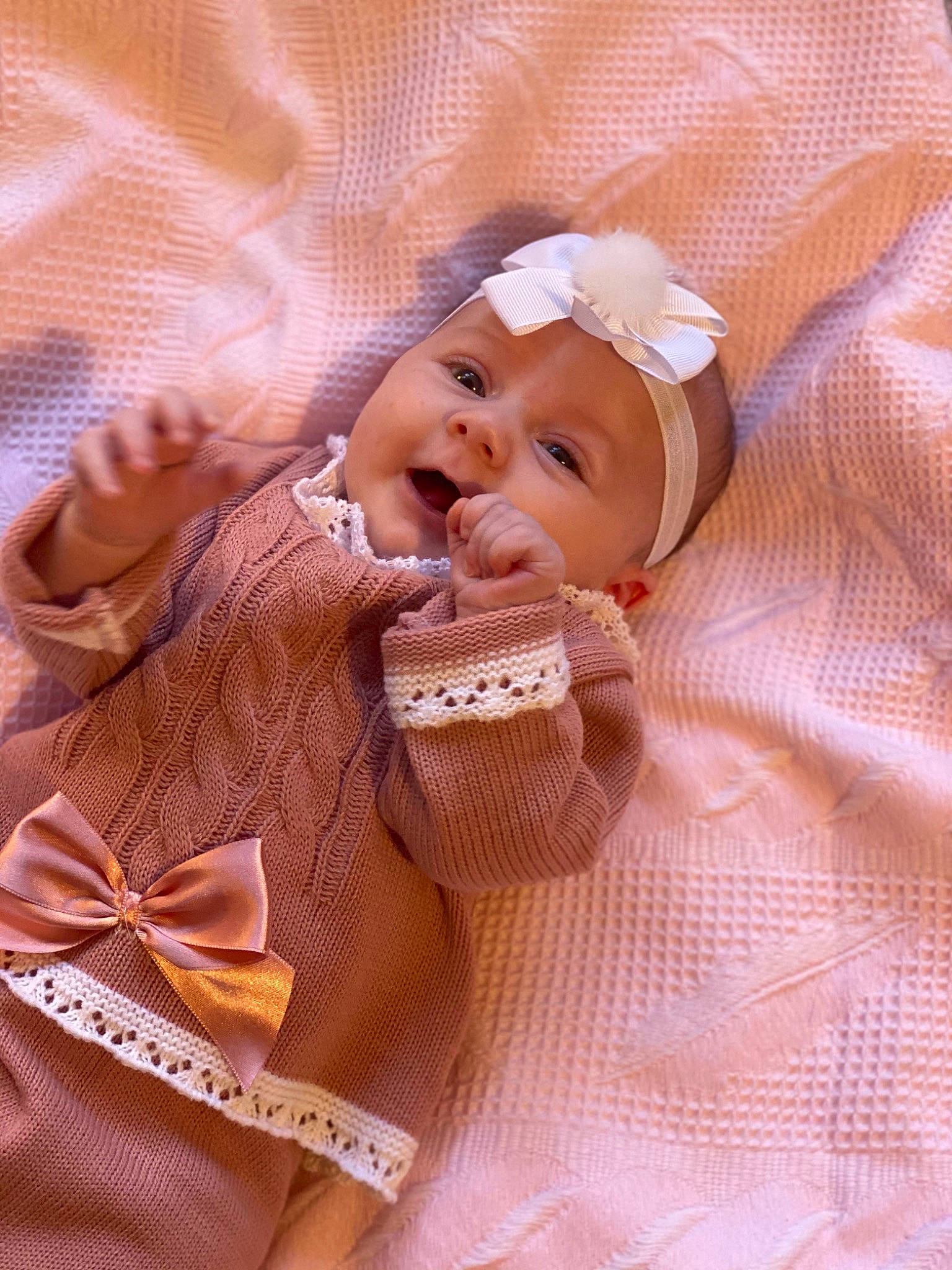 Aryana joined the competition — help win amazing prizes! baby, baby_products, baby_toddler_clothing, child, comfort, drinkware, face, finger, happy, hat, head, headwear, linens, lip, pattern, peach, person, product, skin, sleeve