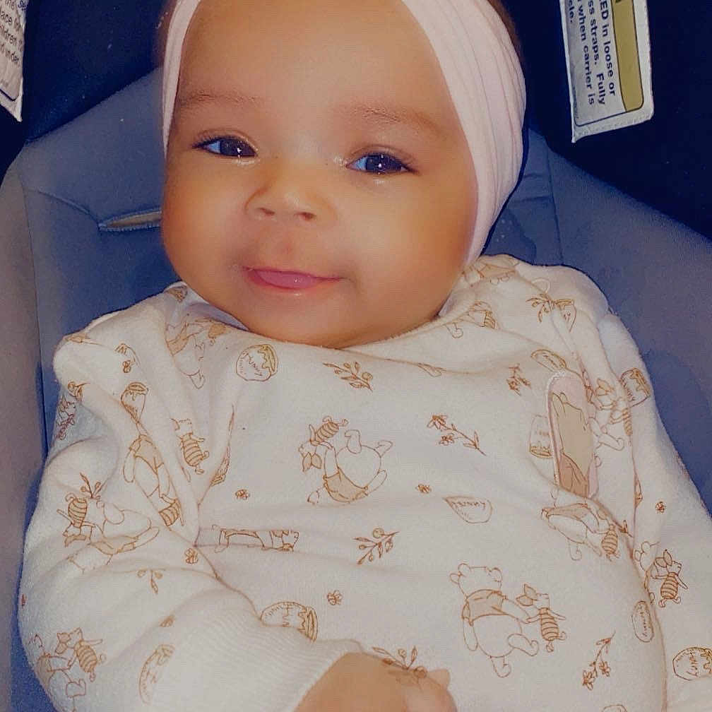 Xaiari is registered to the contest to win money with this photo: accessories, baby, clothing, cushion, dress, face, furniture, happy, hat, head, headband, homedecor, newborn, pants, person, photography, portrait, smile, t_shirt, text