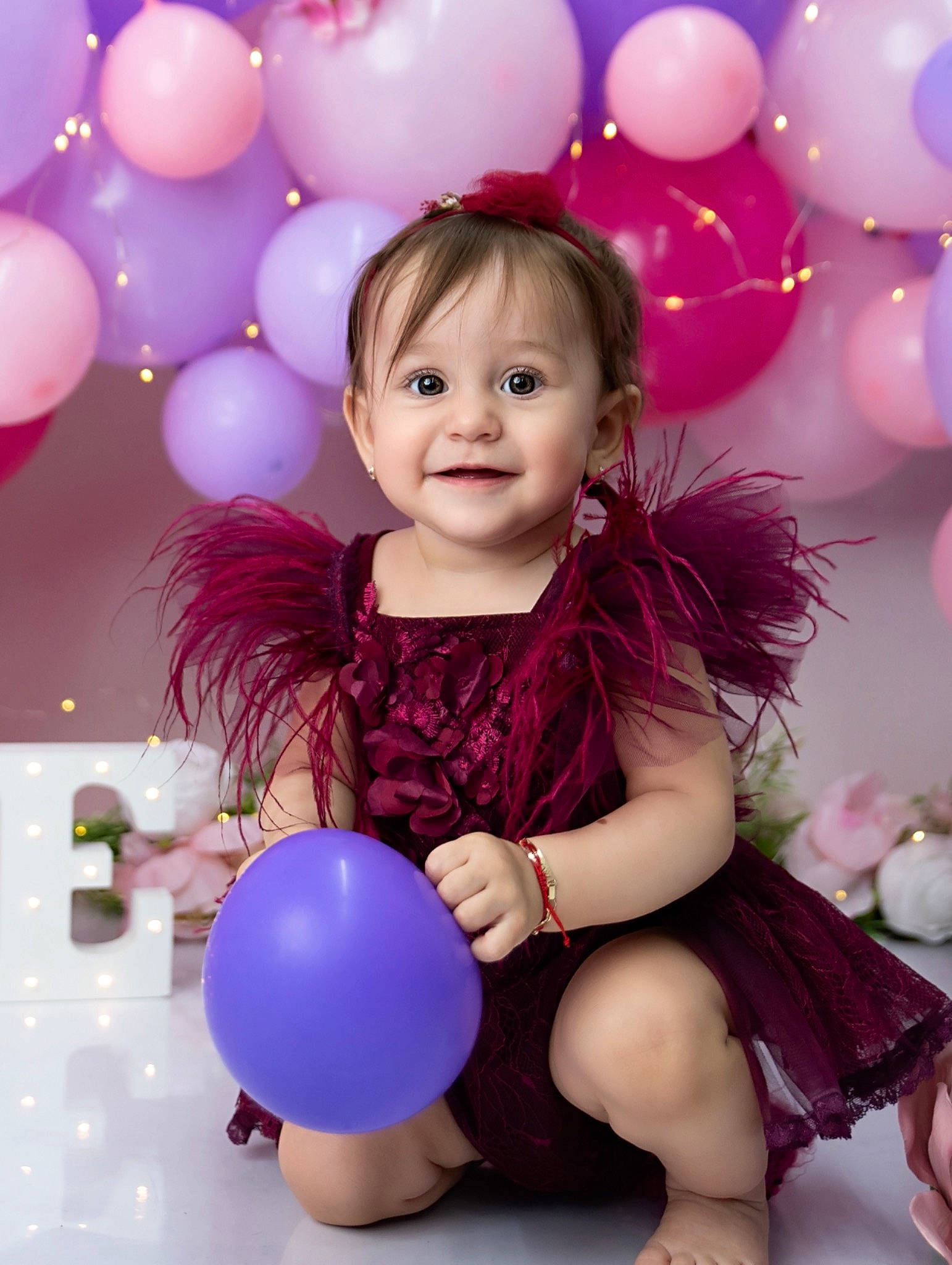 Aniya is registered to the contest to win money with this photo: baby_toddler_clothing, balloon, beauty, child, dress, facial_expression, fun, hair, happy, joy, lighting, magenta, organ, party_supply, person, photograph, pink, purple, smile, toddler
