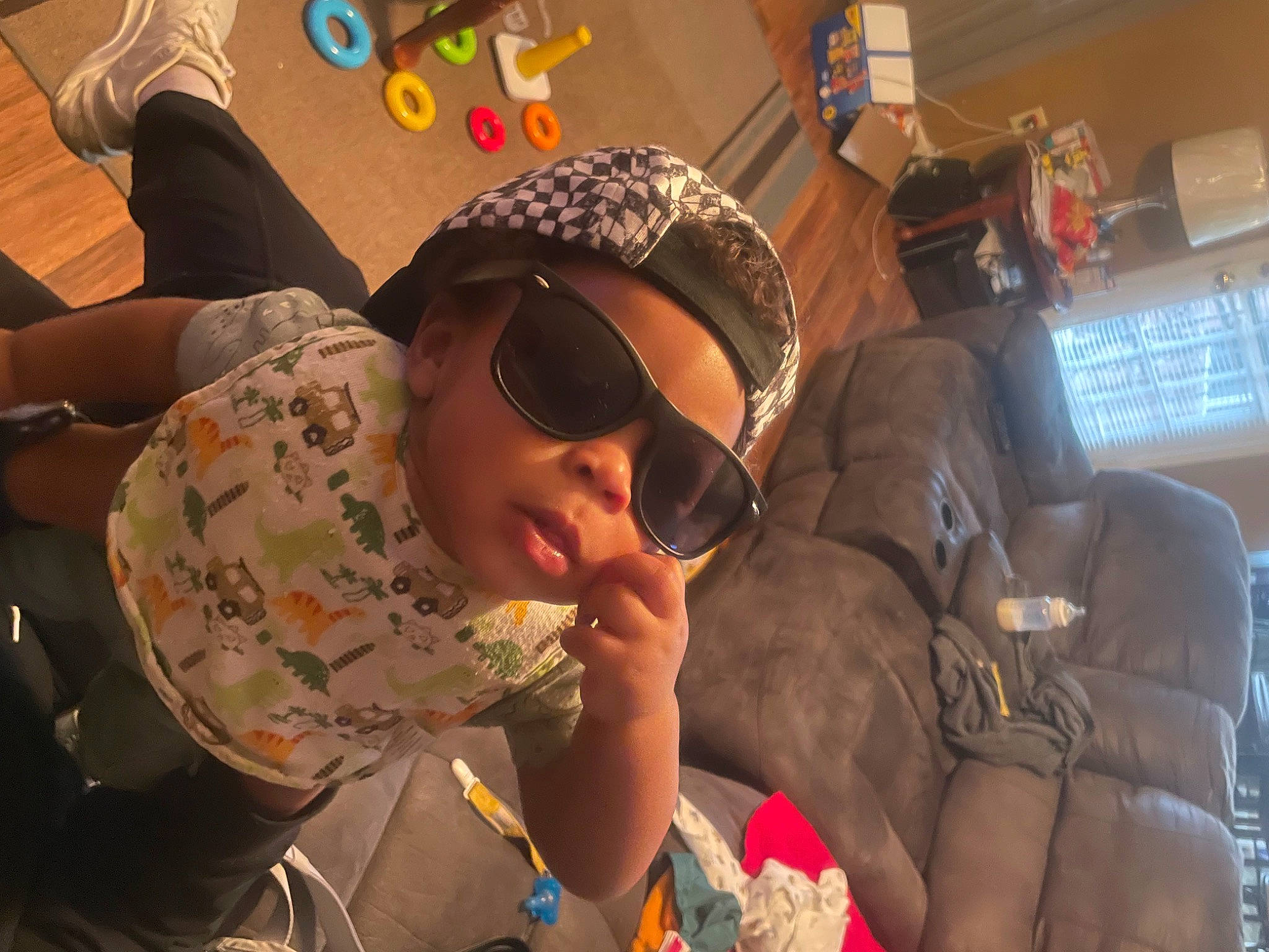 Antonio joined the competition — help win amazing prizes! audio_equipment, baseball_cap, cap, child, comfort, event, eyewear, fashion_accessory, fun, goggles, headwear, leisure, mouth, pattern, person, personal_protective_equipment, recreation, room, sitting, sunglasses