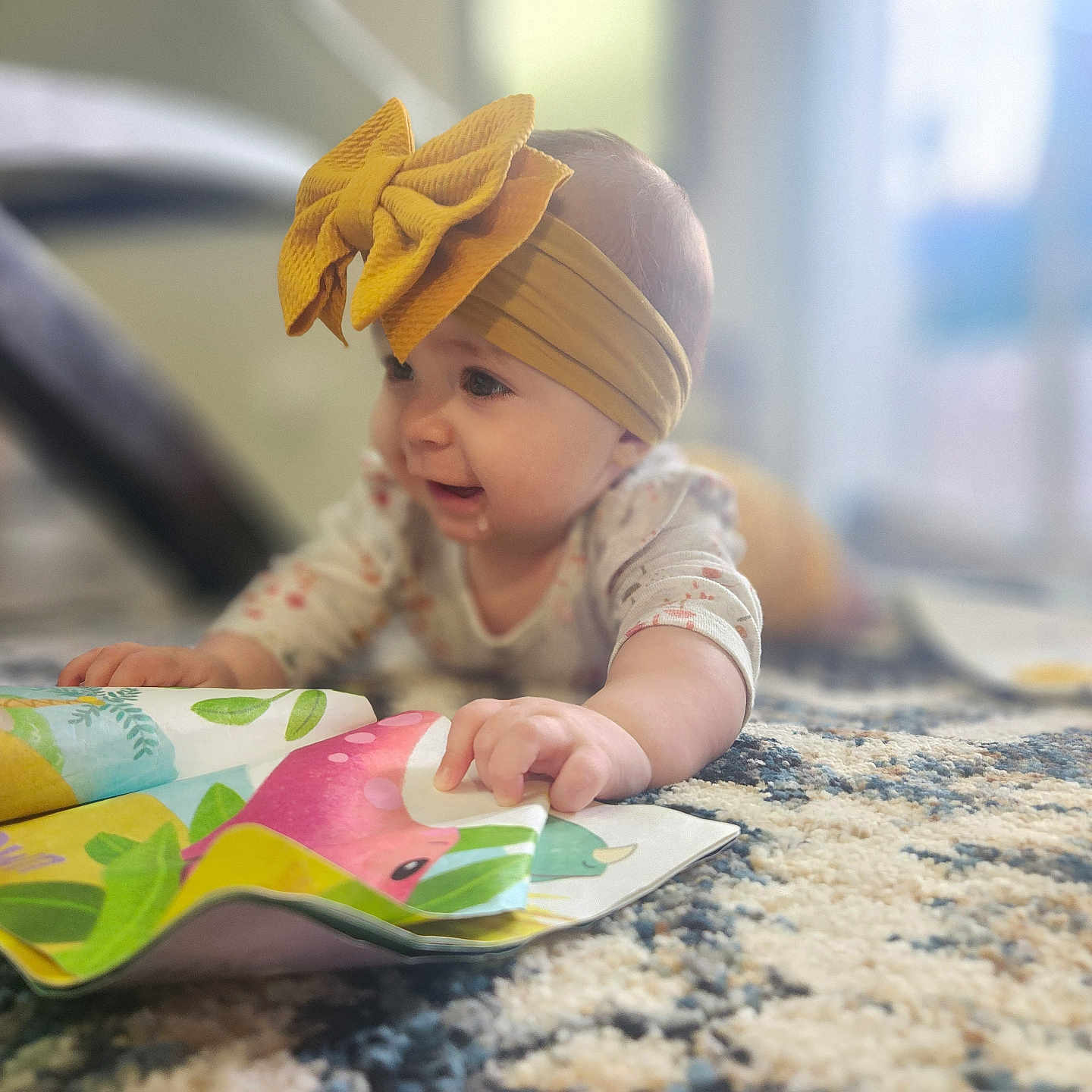 Harleyray is registered to the contest to win money with this photo: accessories, applique, baby, bodypart, bonnet, cap, clothing, crawling, face, finger, hand, hat, head, headband, person, photography, portrait, quilt, reading, sitting