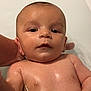 baby, child, infant, water, bath, skin, hand, face, eyes, expression, person, young, cute, wet, head, arm, shoulder, indoors, bathroom, support