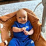 Silas joined the competition — help win amazing prizes! baby, smiling, blue_clothing, nike, blanket, brown_blanket, sun_pattern, infant, happy, cute, indoor, carpet, furniture, baby_bouncer, child, person, portrait, sitting, small_hands, head