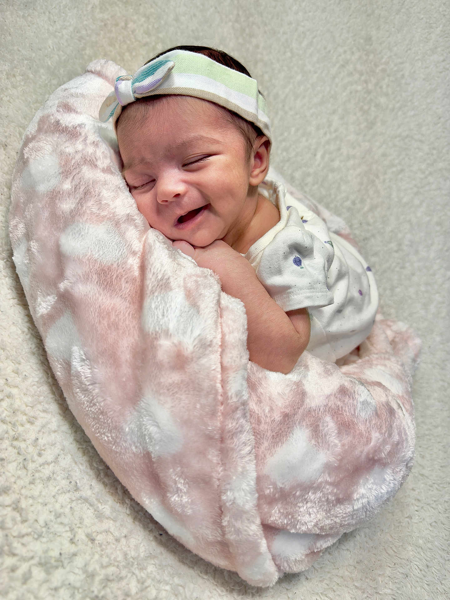 Aarna joined the competition — help win amazing prizes! baby, infant, smiling, sleeping, headband, blanket, soft_texture, cozy, wrapped, cute, newborn, white_clothing, pink, relaxation, indoor, portrait, child, peaceful, happy, toddler
