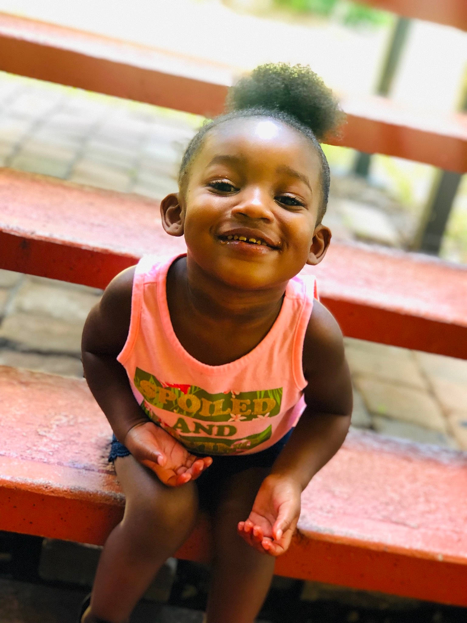 Bria is registered to the contest to win money with this photo: adaptation, child, face, facial_expression, fun, happy, head, joy, leisure, people, person, sitting, skin, smile, summer, toddler, vacation