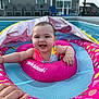 Espyn is registered to the contest to win money with this photo: baby, child, swimming_pool, pool_float, inflatable, water, smiling, happy, outdoor, summer, person, swimsuit, pink, blue, hand, backyard, plastic, recreation, leisure, fun