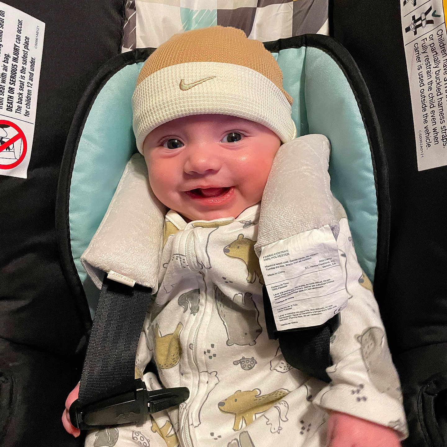 Maverick joined the competition — help win amazing prizes! baby, baby_fashion, beanie, car_seat, child, clothing, cute, happy, hat, indoor, infant, infant_fashion, nike, onesie, padding, person, portrait, safety_straps, seatbelt, smiling