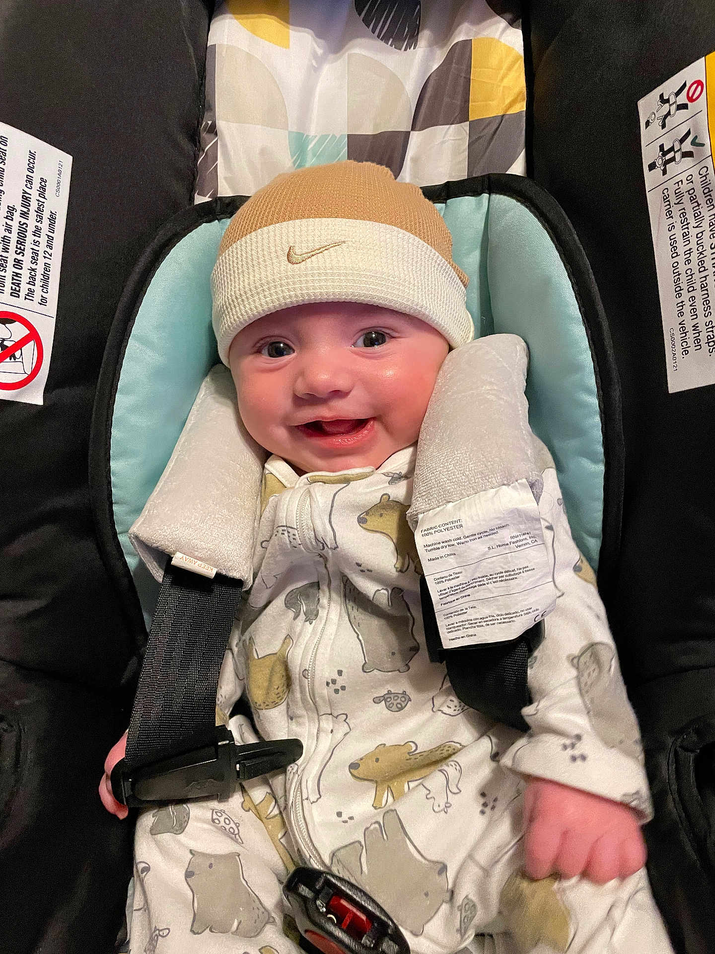Maverick joined the competition — help win amazing prizes! baby, smiling, infant, car_seat, onesie, hat, nike, beanie, safety_straps, padding, cute, child, happy, clothing, seatbelt, indoor, portrait, person, infant_fashion, baby_fashion