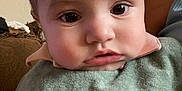 Maverick joined the competition — help win amazing prizes! baby, child, face, portrait, indoor, bib, clothing, curious, pouty, person, head, young, infant, skin, expression, closeup, cute, eyes, hair, sitting