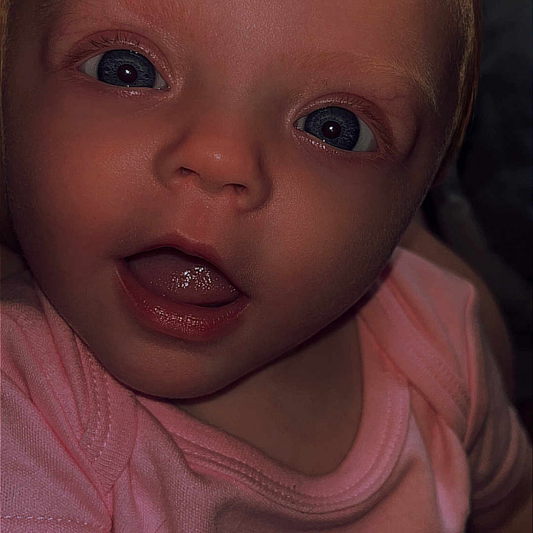 Madelyn joined the competition — help win amazing prizes! applique, baby, bodypart, clothing, cosmetics, couch, face, finger, hand, happy, head, lipstick, mouth, newborn, pattern, person, photography, portrait, smile, t_shirt