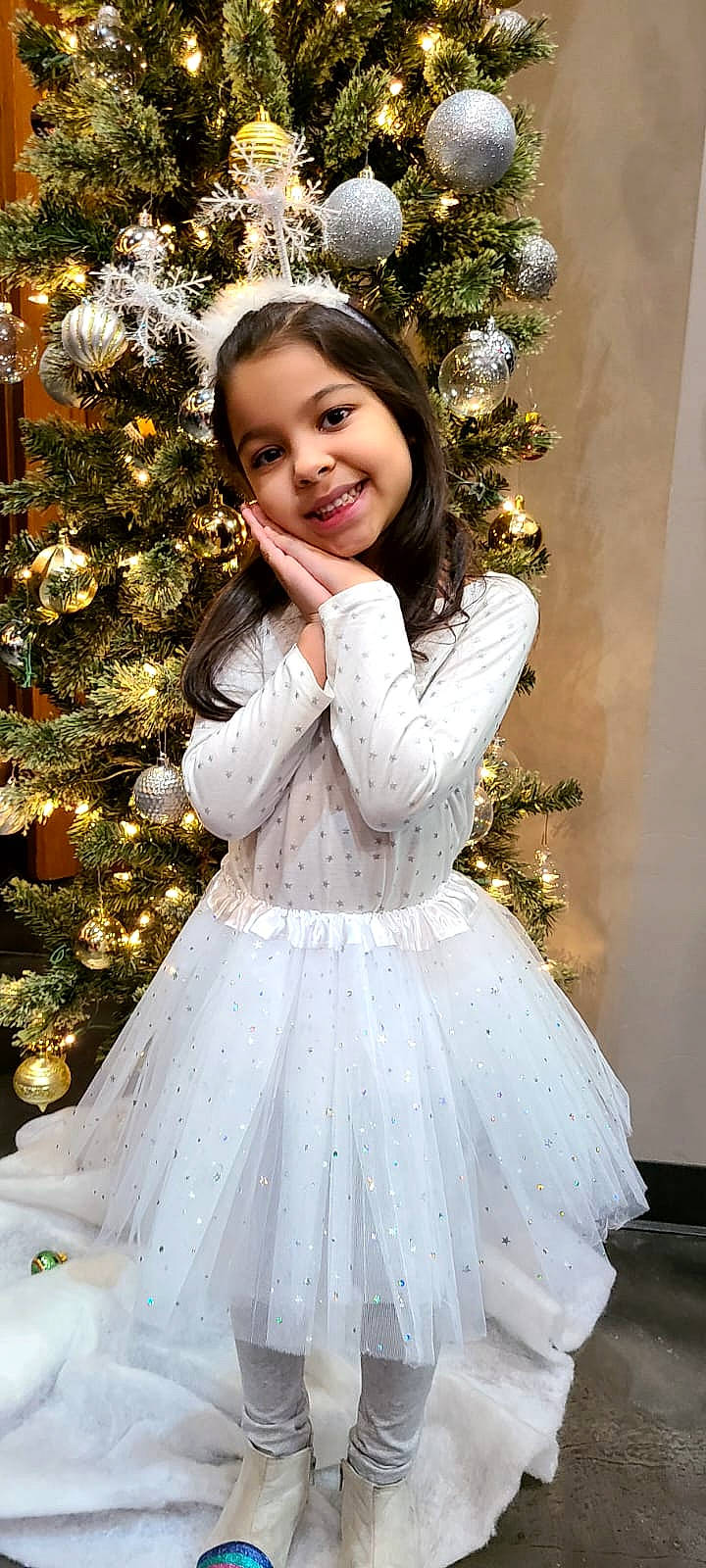 Laura Sophia joined the competition — help win amazing prizes! christmas_decoration, christmas_ornament, christmas_tree, day_dress, dress, flash_photography, hair, happy, head, holiday_ornament, human_body, joy, one_piece_garment, ornament, outerwear, person, sleeve, smile, standing, tree