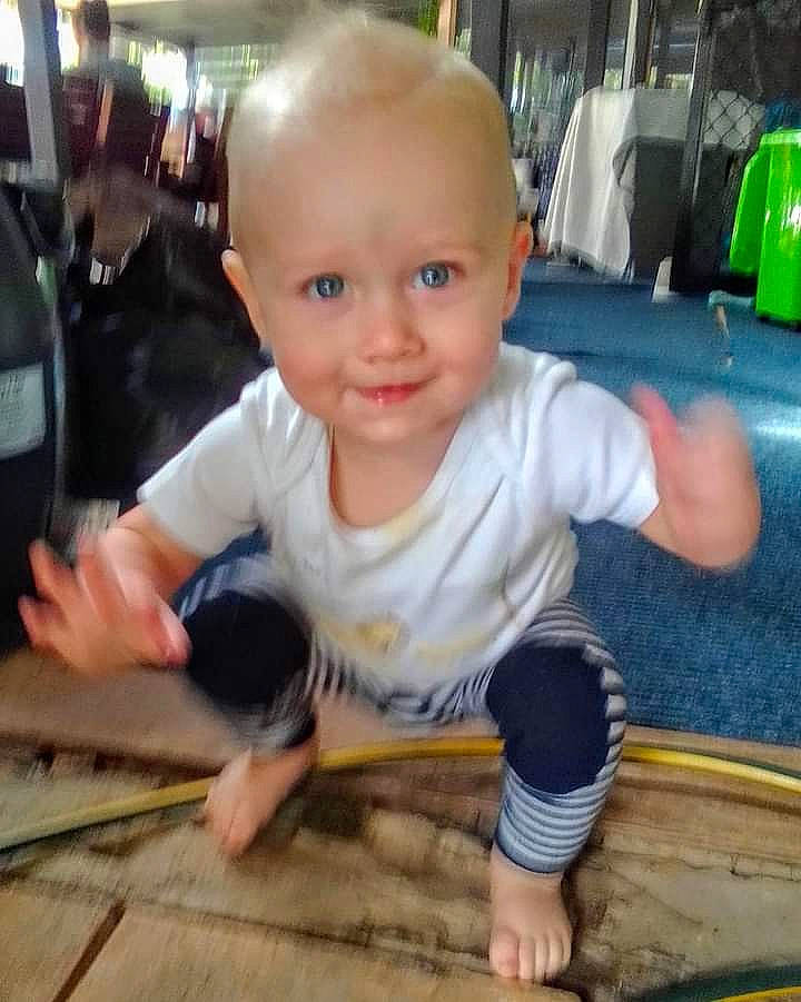 Eli joined the competition — help win amazing prizes! baby, baby_toddler_clothing, cheek, child, finger, floor, flooring, foot, fun, happy, hardwood, human_leg, joy, person, sitting, smile, t_shirt, thumb, toddler, varnish