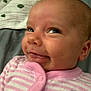 Suzanna is registered to the contest to win money with this photo: baby, bodypart, clothing, coat, cushion, face, happy, head, jacket, knitwear, laughing, mouth, newborn, person, photography, portrait, quilt, selfie, smile, sweater