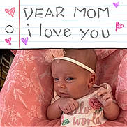 Suzanna is registered to the contest to win money with this photo: accessories, baby, bodypart, clothing, cushion, face, finger, furniture, hand, hat, head, headband, homedecor, newborn, person, photography, portrait, quilt, t_shirt, text
