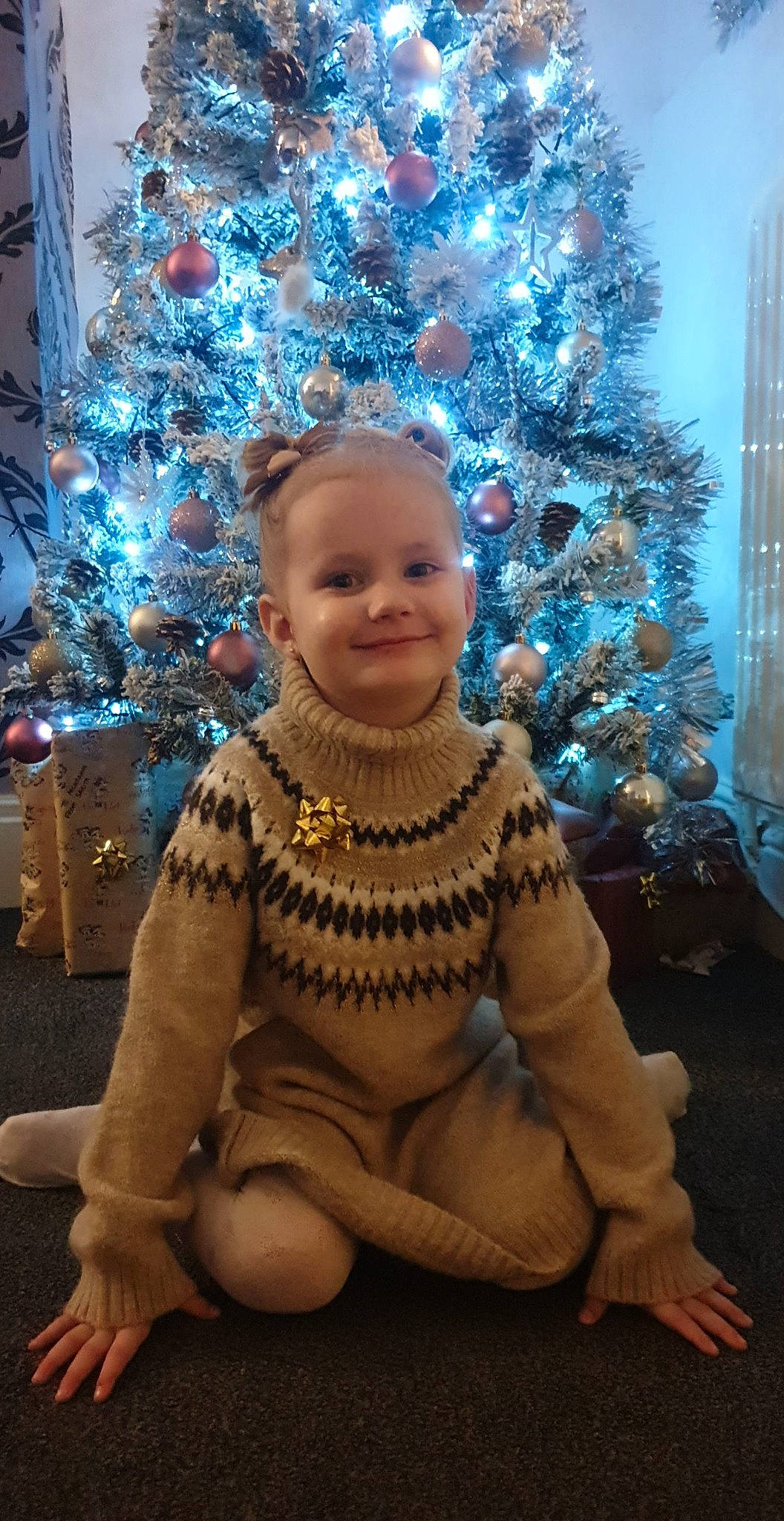 Mckenna-mae Grace is registered to the contest to win money with this photo: blue, christmas_decoration, christmas_ornament, christmas_tree, dress, electric_blue, event, eye, face, fun, happy, holiday_ornament, human_body, joy, ornament, person, plant, purple, smile, standing