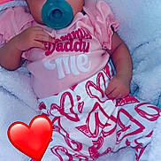 Ariyah is registered to the contest to win money with this photo: baby, pacifier, headband, pink_clothing, heart_pattern, blanket, infant, cute, sleepwear, child, soft_texture, relaxing, indoors, portrait, lying_down, cozy, adorable, small_hand, foot, red_heart_emoji