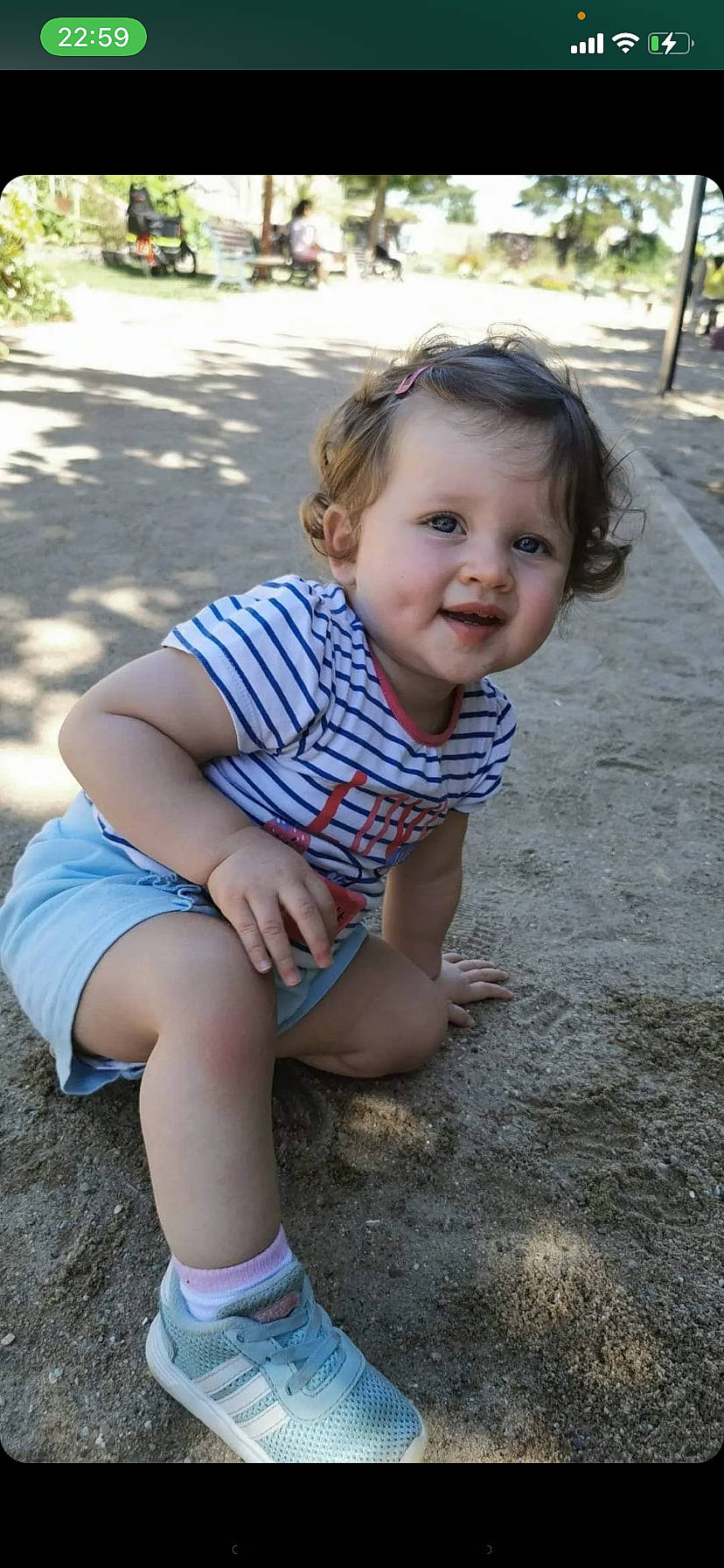 Love participe au concours pour gagner de l'argent avec cette photo : baby_toddler_clothing, chin, eye, face, facial_expression, grass, hair, hairstyle, happy, head, iris, leg, lip, mouth, person, pink, plant, shorts, skin, smile