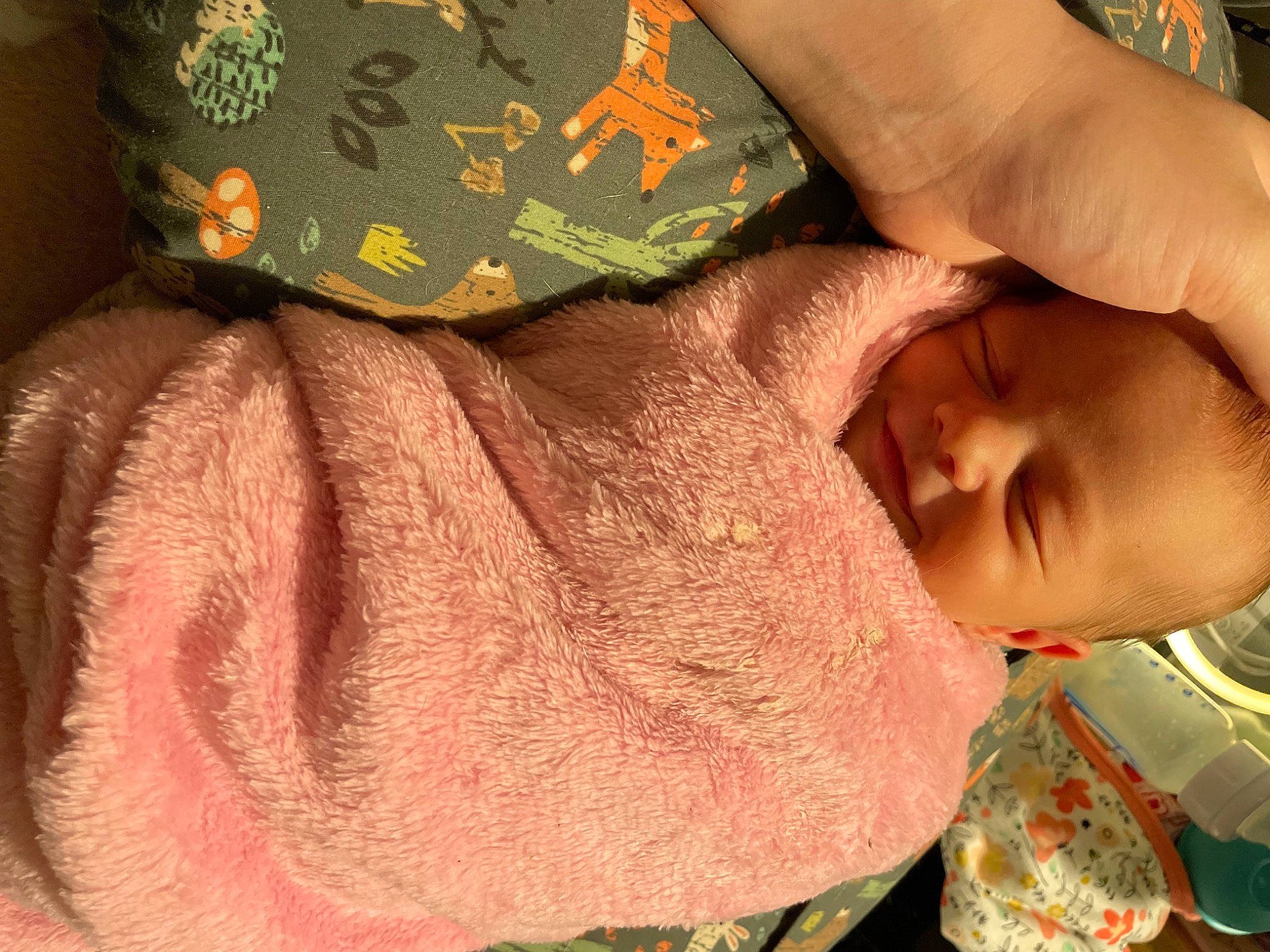 Octavia is registered to the contest to win money with this photo: baby, baby_toddler_clothing, finger, gesture, hand, happy, headgear, linens, military_camouflage, nail, neck, pattern, person, skin, sleeve, textile, thumb, toddler, wool, woolen