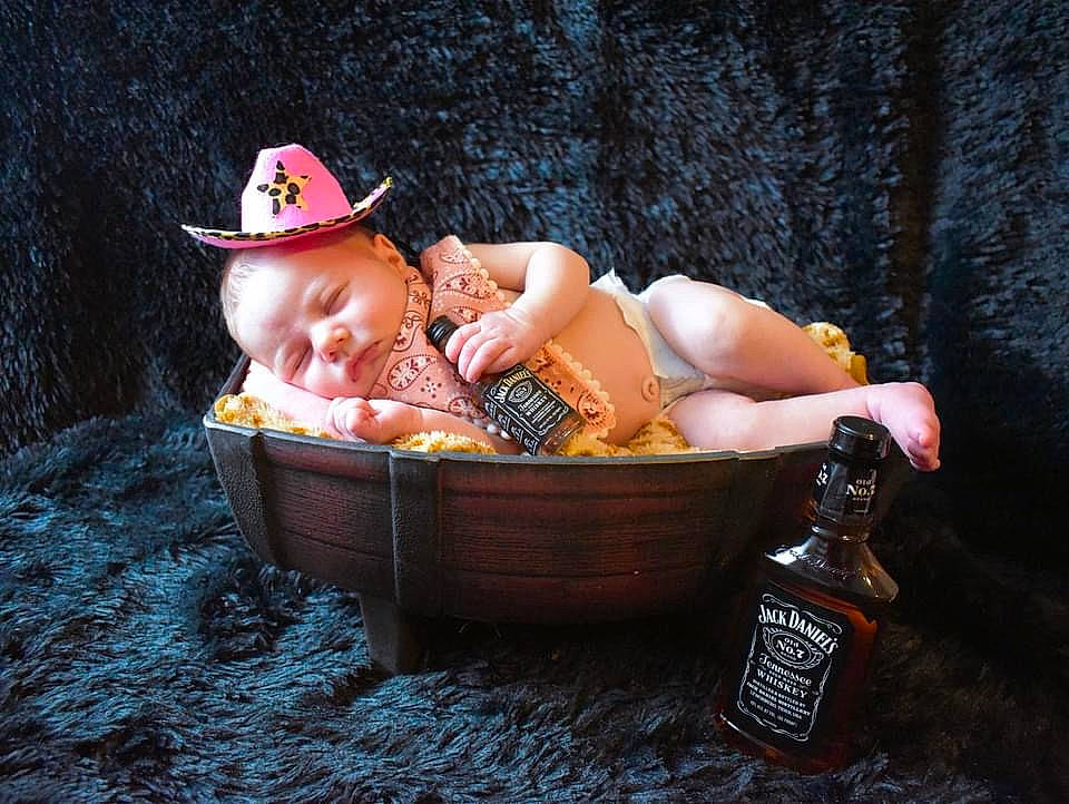 Octavia is registered to the contest to win money with this photo: baby, baby_products, bottle, cap, child, fedora, flash_photography, fruit, fun, grass, hat, leisure, person, personal_protective_equipment, recreation, sitting, sun_hat, sunglasses, swimwear, toddler