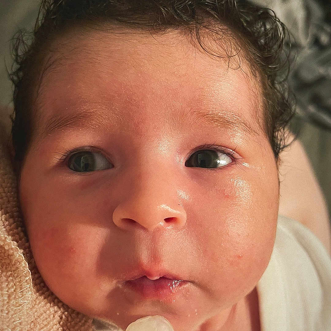 Zeynep joined the competition — help win amazing prizes! baby, blanket, closeup, clothing, curly_hair, cute, expression, eyes, face, indoors, infant, milk_bottle, mouth, newborn, nipple, person, portrait, skin, soft_lighting, young_child