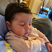Zeynep joined the competition — help win amazing prizes! baby, sleeping, infant, closeup, person, indoors, cozy, face, hair, clothing, hand, couch, blanket, soft_light, peaceful, child, portrait, relaxation, home, rest