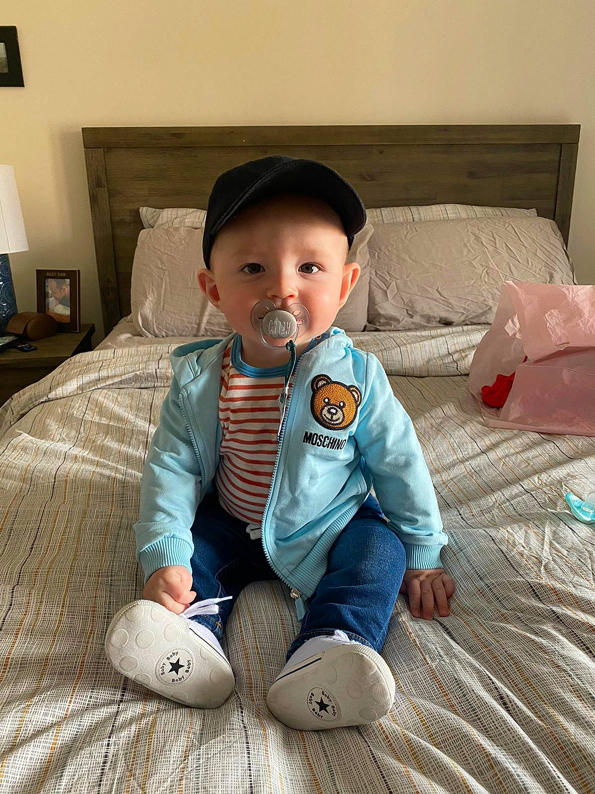 Ivan is registered to the contest to win money with this photo: baby, baby_toddler_clothing, child, comfort, couch, eye, floor, flooring, hardwood, head, headwear, lamp, leg, person, picture_frame, sitting, skin, sleeve, smile, standing