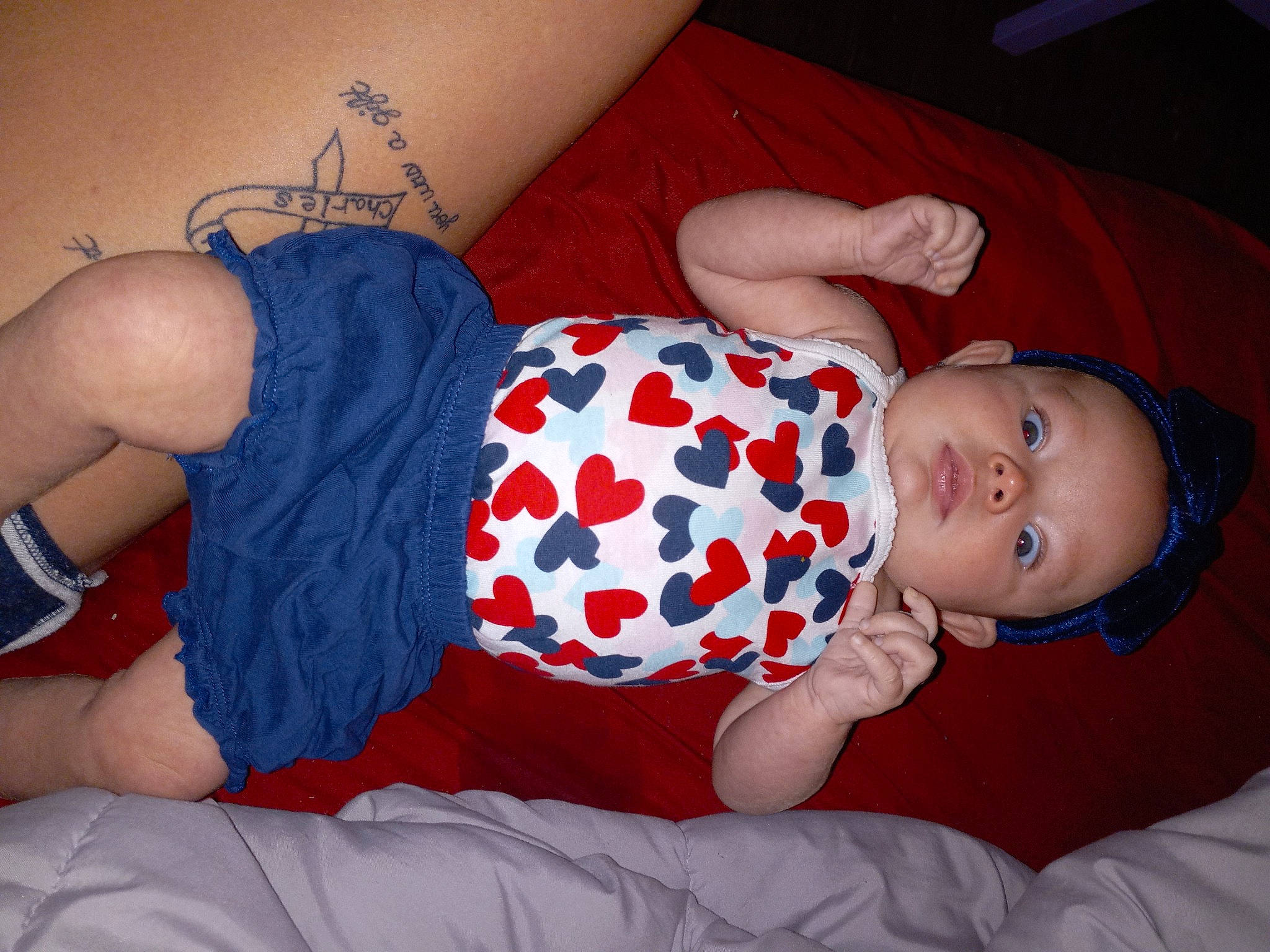 Avalynn joined the competition — help win amazing prizes! azure, baby, baby_toddler_clothing, comfort, elbow, facial_expression, finger, hand, headgear, human_body, joint, knee, leg, mouth, muscle, orange, person, skin, sleeve, textile