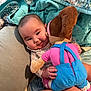 Lena-Sage joined the competition — help win amazing prizes! baby, child, plush_toy, doll, cuddling, blanket, cushion, indoor, smiling, happy, person, infant, cute, soft_toy, hand, clothing, fabric, comfort, cozy, portrait