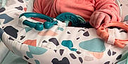 Lena-Sage joined the competition — help win amazing prizes! baby, infant, smiling, happy, toy, baby_seat, coral_clothing, patterned_fabric, hand, face, cute, child, indoor, baby_toys, seat, legs, footed_pajamas, colorful, cheerful, playful