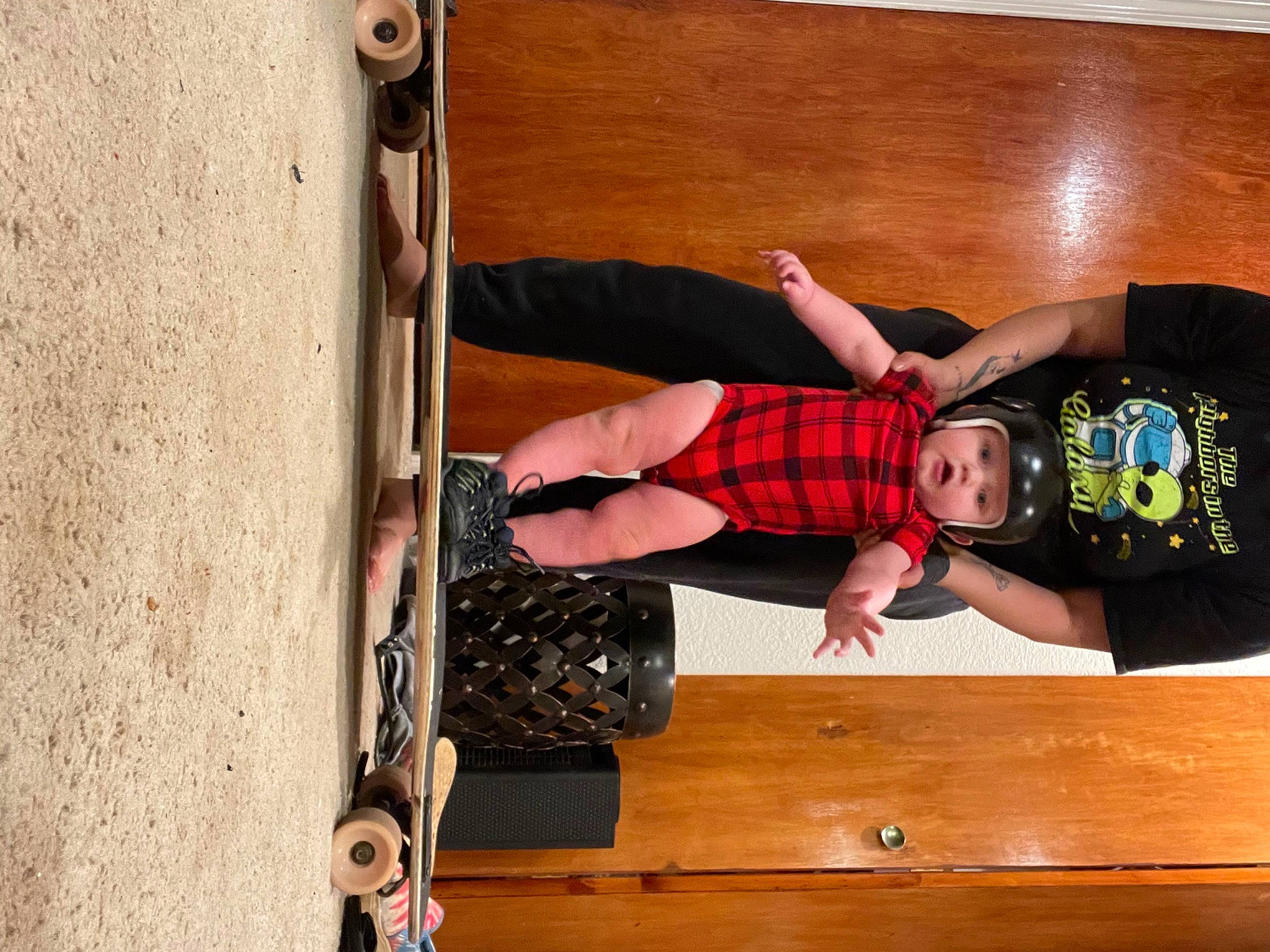 Caspian joined the competition — help win amazing prizes! child, elbow, flooring, fun, hardwood, headwear, helmet, human_leg, knee, leisure, luggage_and_bags, person, room, shorts, shoulder, sitting, sock, thigh, toddler, varnish