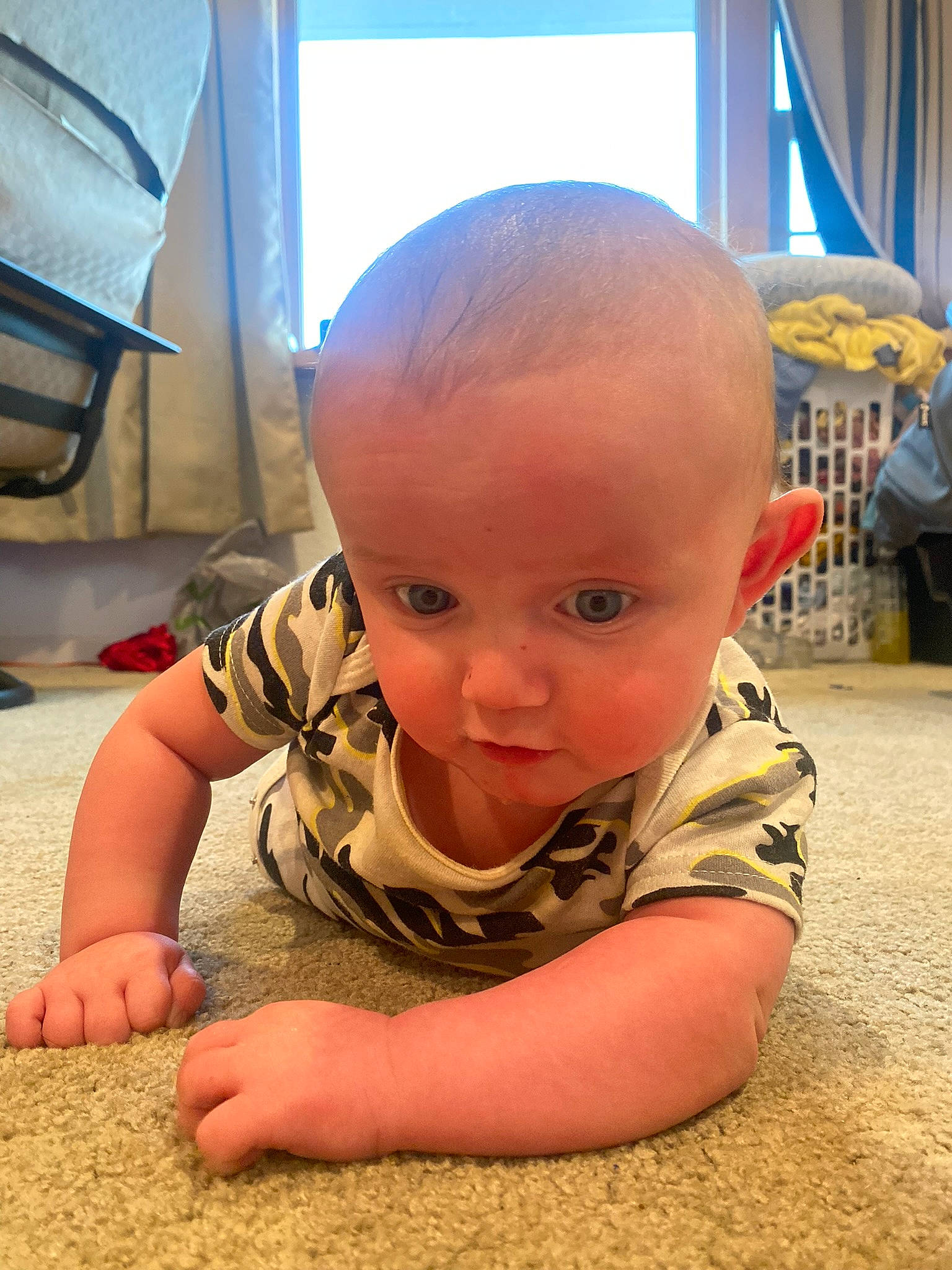 Caspian is registered to the contest to win money with this photo: baby, baby_toddler_clothing, cheek, child, comfort, crawling, floor, flooring, foot, fun, happy, hardwood, mammal, person, sitting, skin, smile, soil, toddler, wood