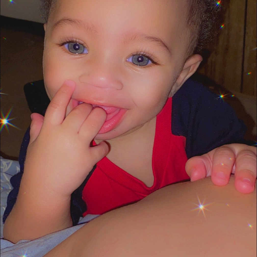 Samuel is registered to the contest to win money with this photo: baby, bodypart, clothing, cosmetics, dress, face, finger, hand, happy, head, laughing, lipstick, mouth, nail, person, photography, portrait, purple, smile, teeth