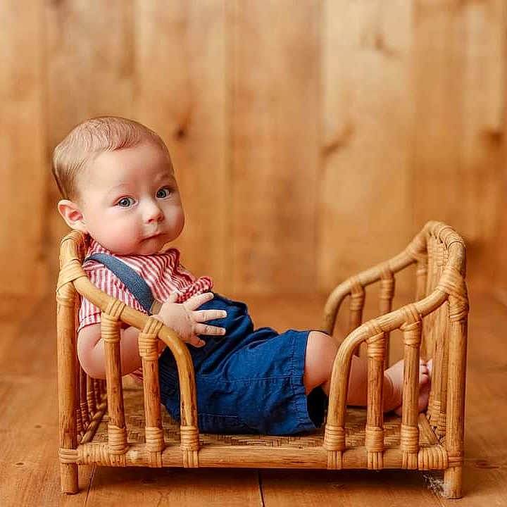 Asta joined the competition — help win amazing prizes! baby, blonde, clothing, crawling, face, hair, hardwood, head, infantbed, jeans, pants, person, sitting, stainedwood, wood