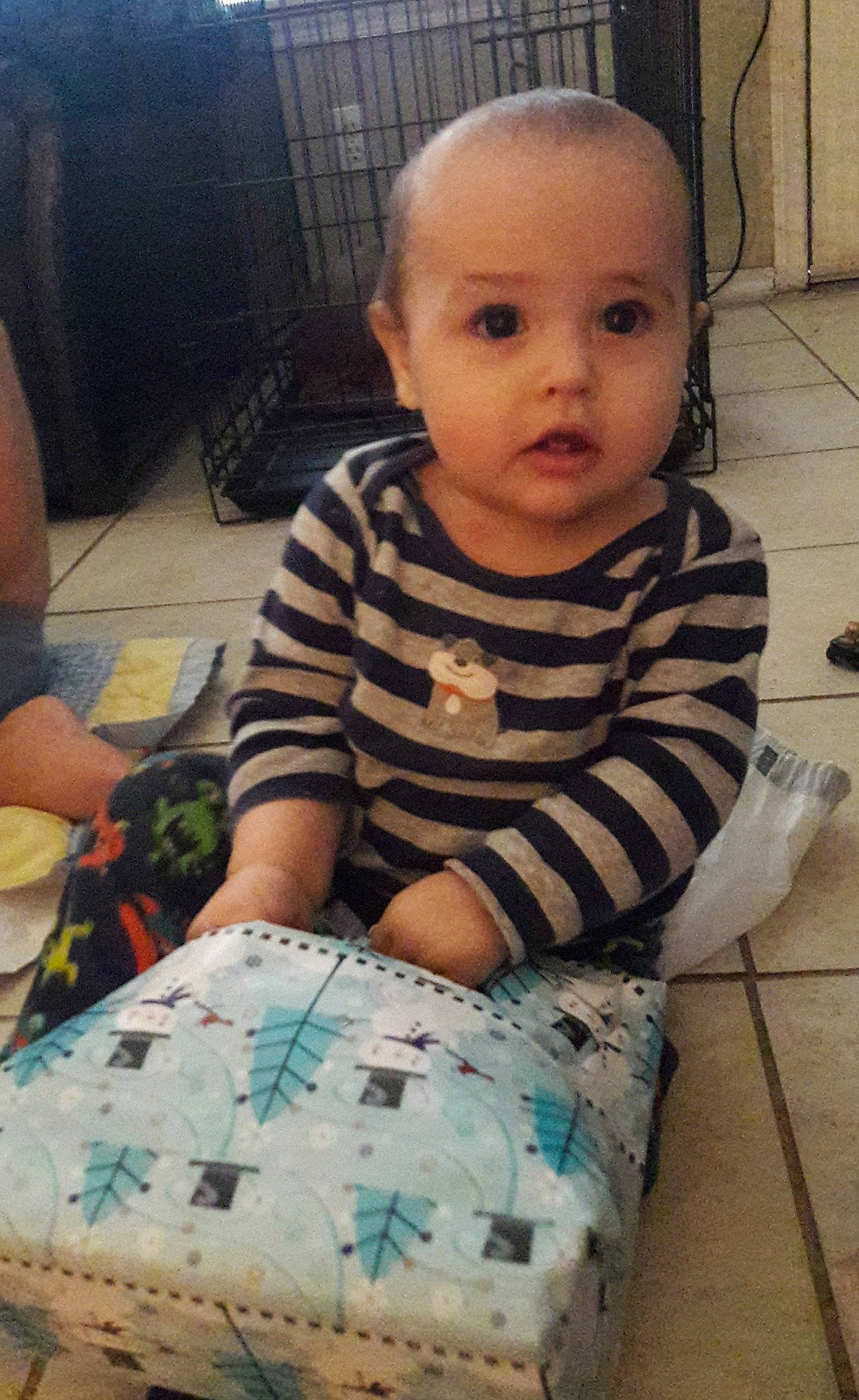 Camron is registered to the contest to win money with this photo: arm, cheek, child, day, eye, girl, head, human_hair_color, infant, iris, organ, pattern, person, play, product, sitting, skin, textile, toddler