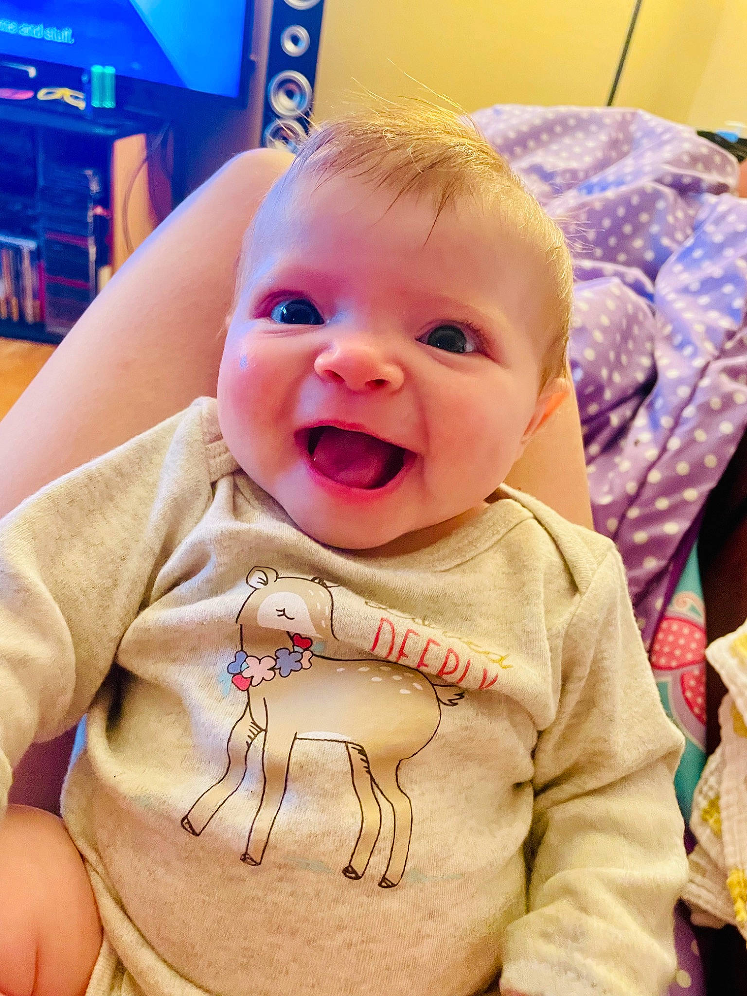 Aurelia is registered to the contest to win money with this photo: baby, baby_laughing, baby_toddler_clothing, blue, cheek, child, chin, facial_expression, fun, happy, iris, mouth, nose, person, product, sitting, skin, sleeve, smile, standing