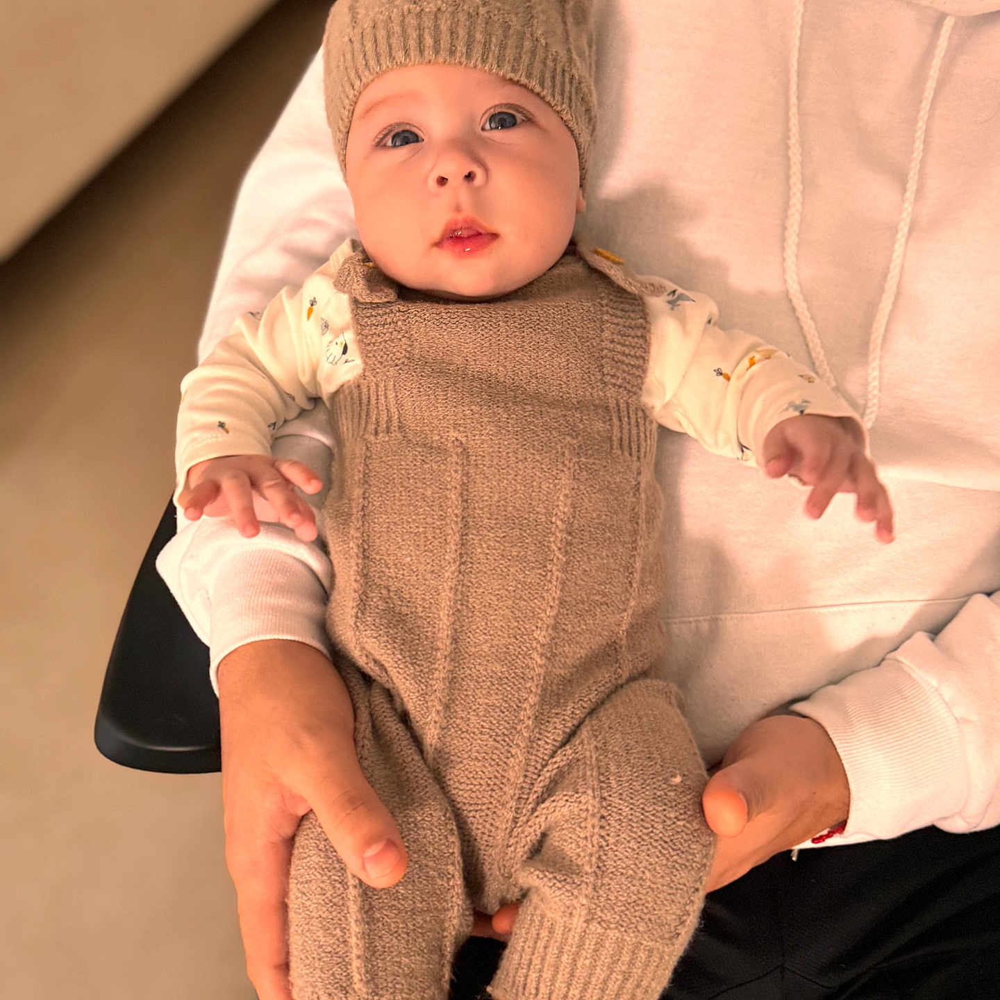 Mateo joined the competition — help win amazing prizes! baby, beanie, bodypart, bonnet, cap, clothing, face, finger, hand, happy, hat, head, hood, hoodie, knitwear, newborn, pants, person, sweater, sweatshirt
