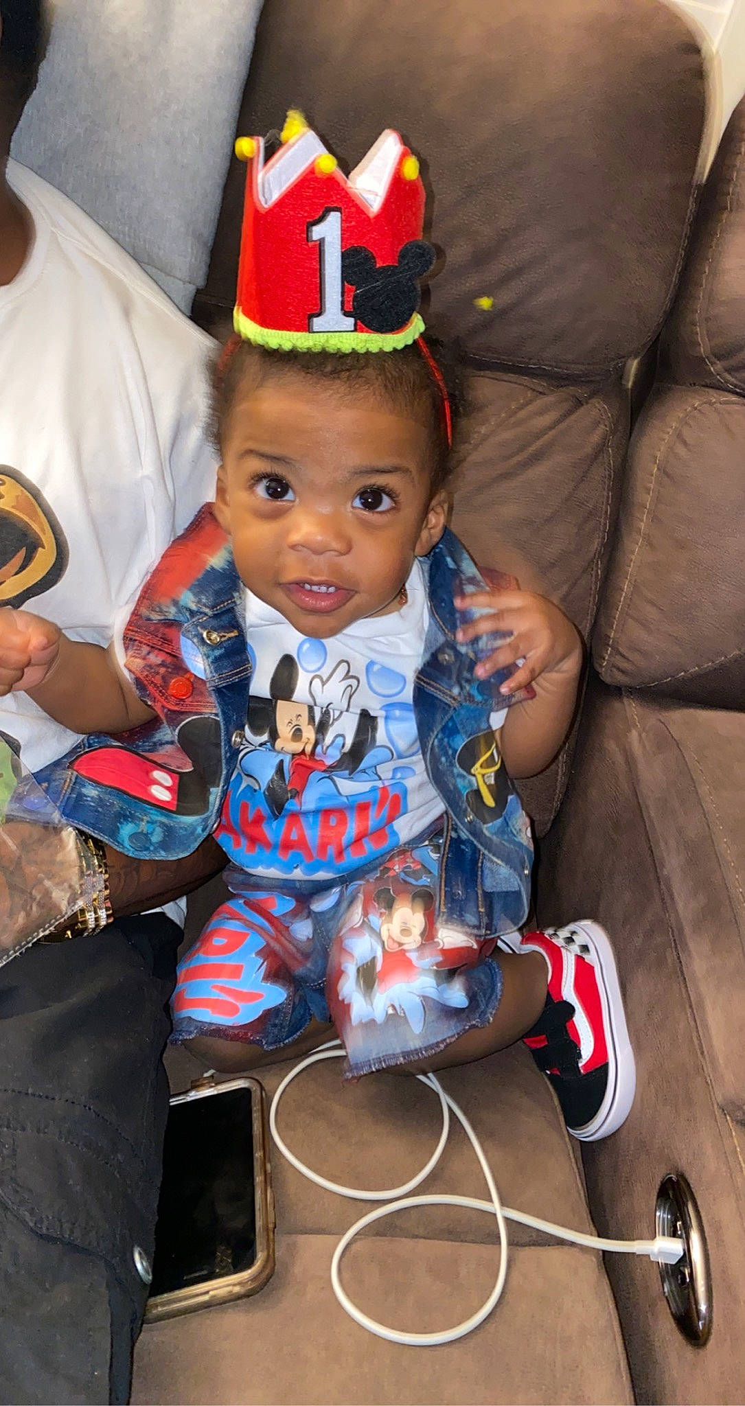 Jakari is registered to the contest to win money with this photo: baby, baby_toddler_clothing, birthday, cap, child, christmas, christmas_eve, costume_hat, event, fashion_accessory, fun, happy, holiday, lap, party_hat, person, play, sitting, toddler, tradition