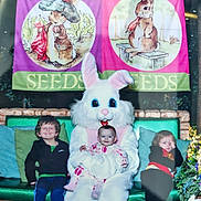 Ava joined the competition — help win amazing prizes! child, baby, easter_bunny, mascot, bench, green_bench, banner, cartoon_bunny, happy, smiling, shy, tired, indoor, decorations, festive, spring, holiday, costume, family, portrait