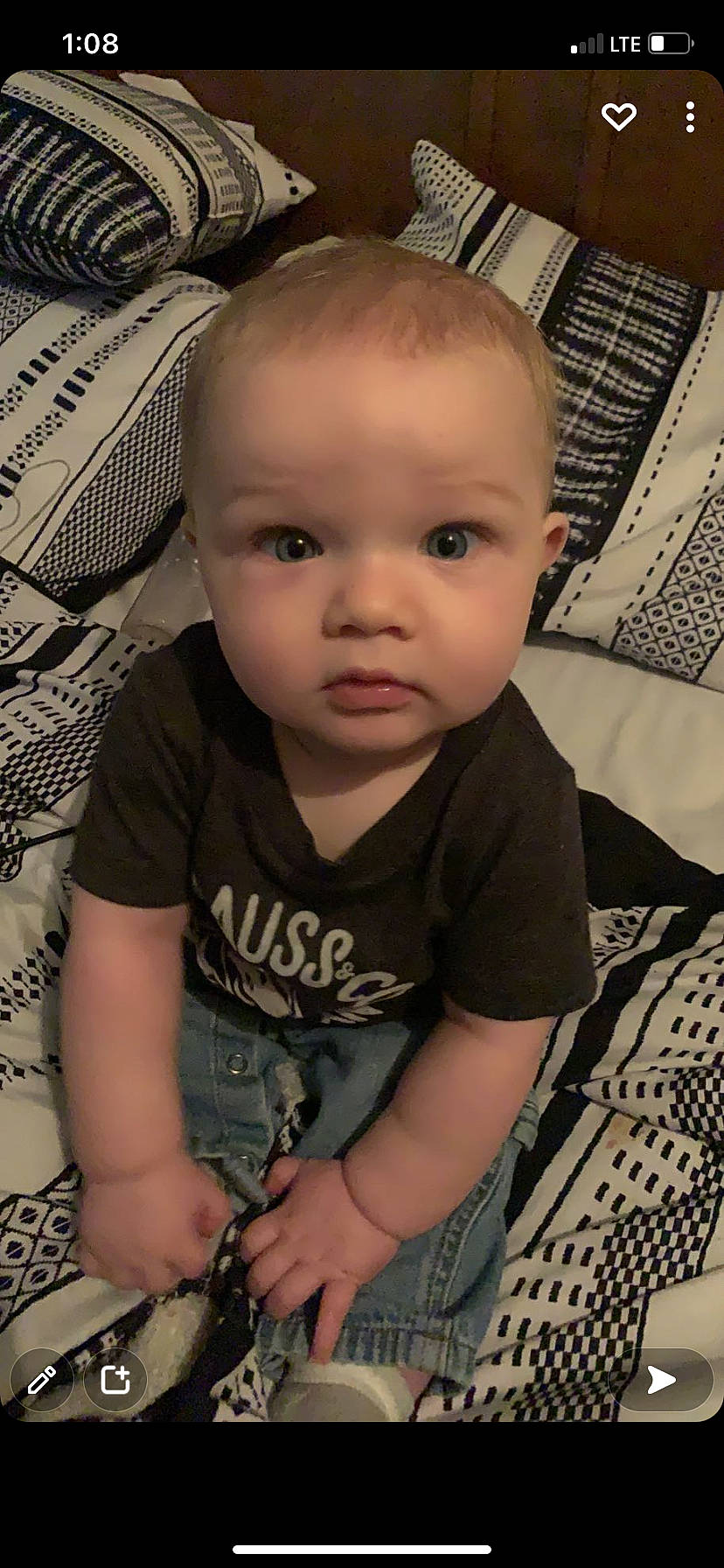 Jacob is registered to the contest to win money with this photo: baby, baby_toddler_clothing, black, cheek, chin, cool, eyelash, face, finger, forehead, hairstyle, head, iris, mouth, nose, person, skin, sleeve, smile, standing