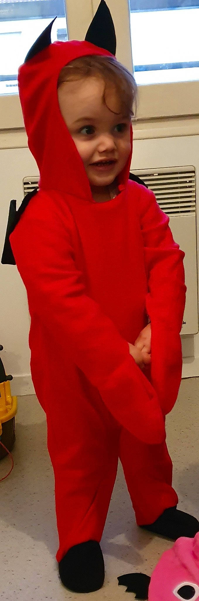 élèna participe au concours pour gagner de l'argent avec cette photo : arm, clothing, costume, fictional_character, hood, hoodie, jacket, joint, magenta, neck, outerwear, person, pink, red, shoulder, sleeve, standing, sweater, t_shirt, top